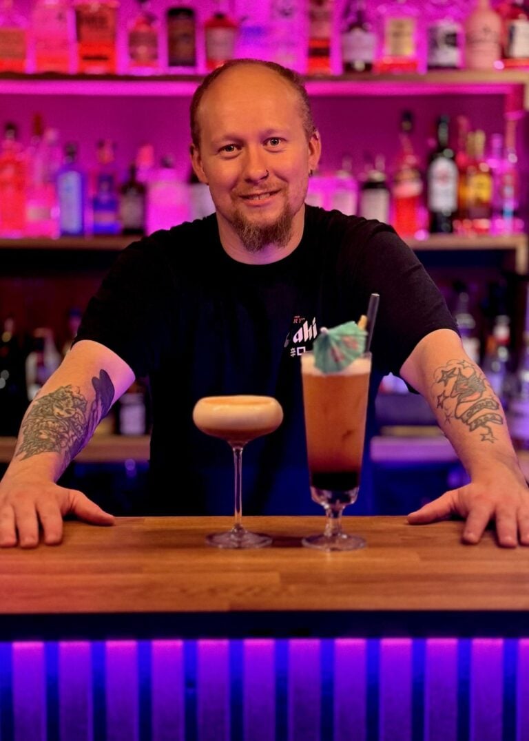 Tiger Fusion bartender with two signature cocktails